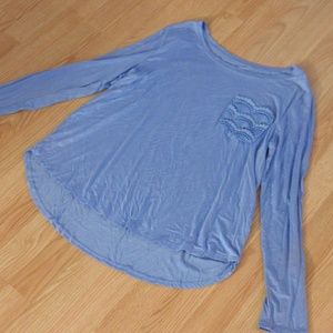A blue long sleeve top.